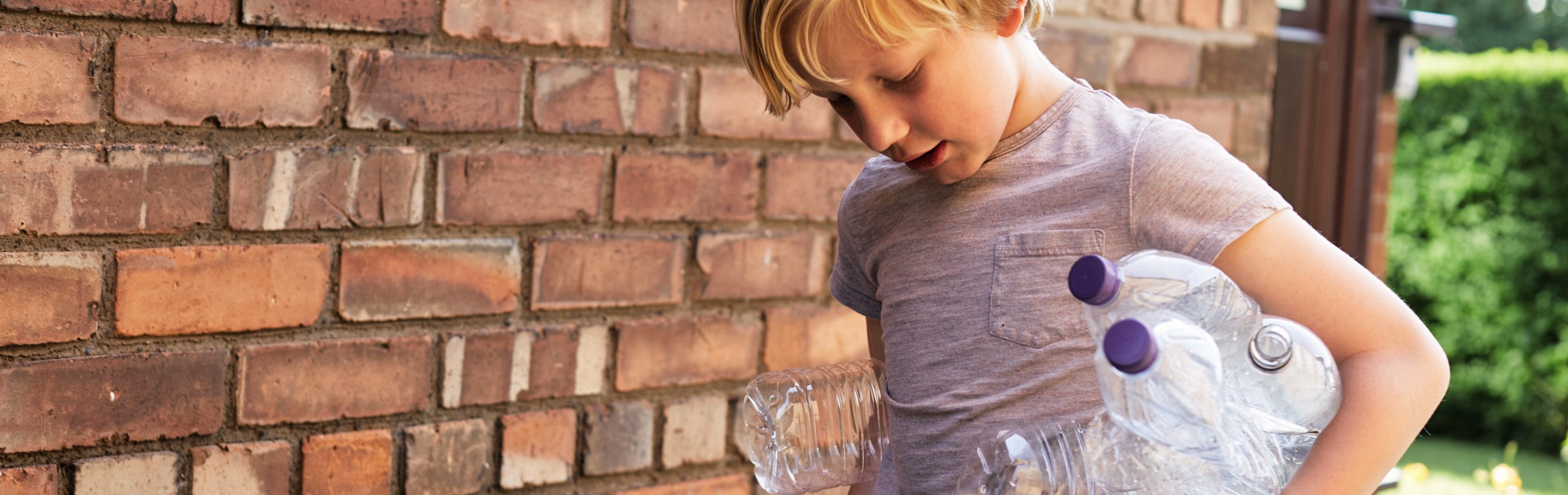 Boy collecting bottles