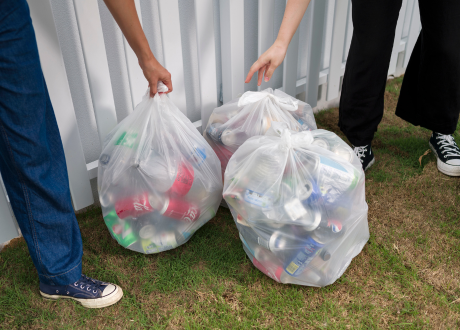 3 clear plastic bags filled with containers