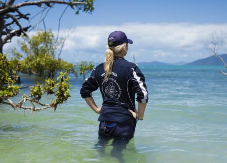 Woman standing in ocean