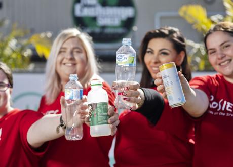 Women holding drink containers