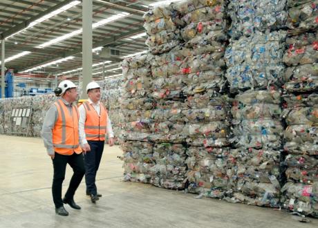 Two men walking in factory