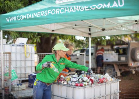 Lady counting containers at a Containers for Change pop up refund point