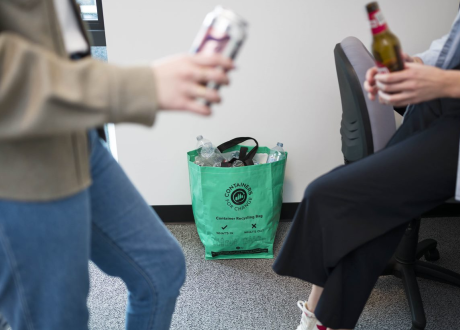 Two people with containers in hand